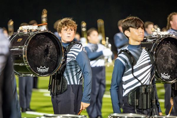 Summit High band members march